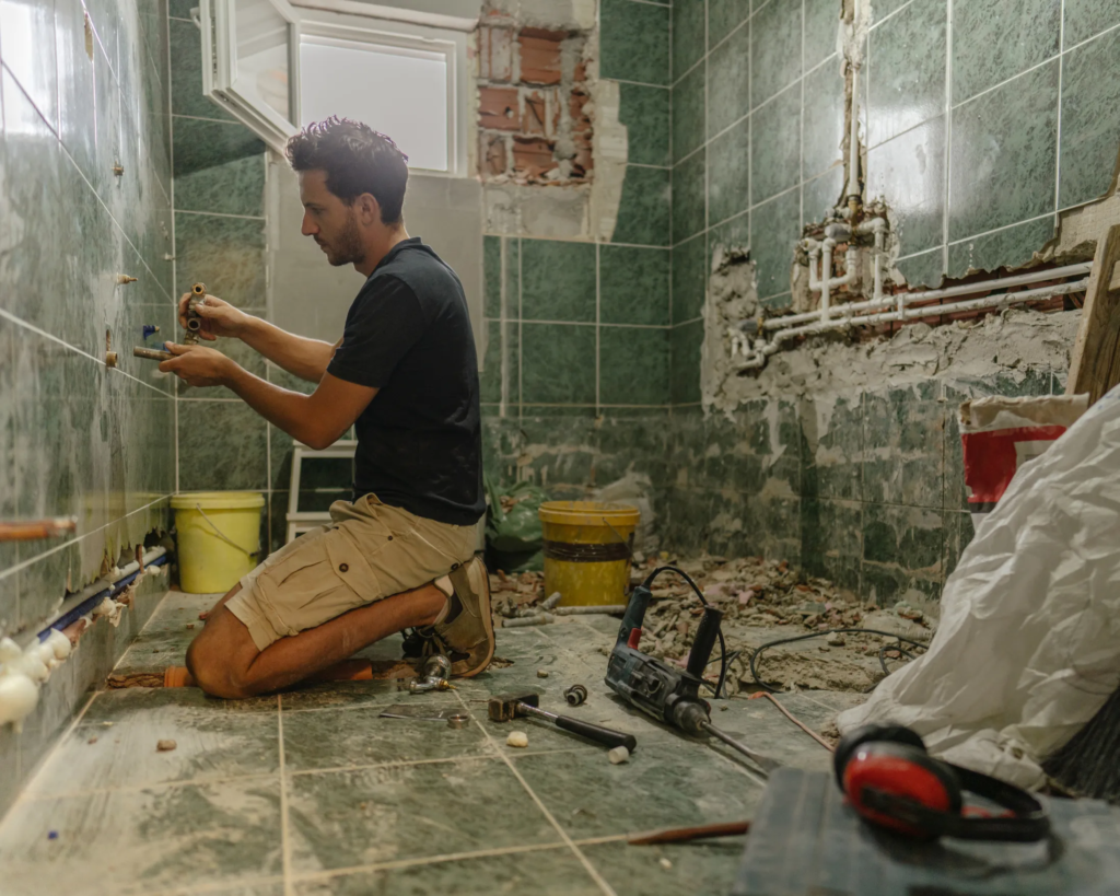 handyman renovating modern bathroom in Toronto condo