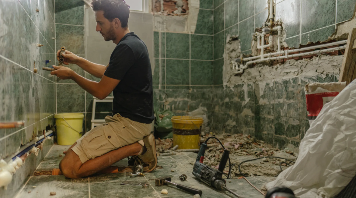 handyman renovating modern bathroom in Toronto condo