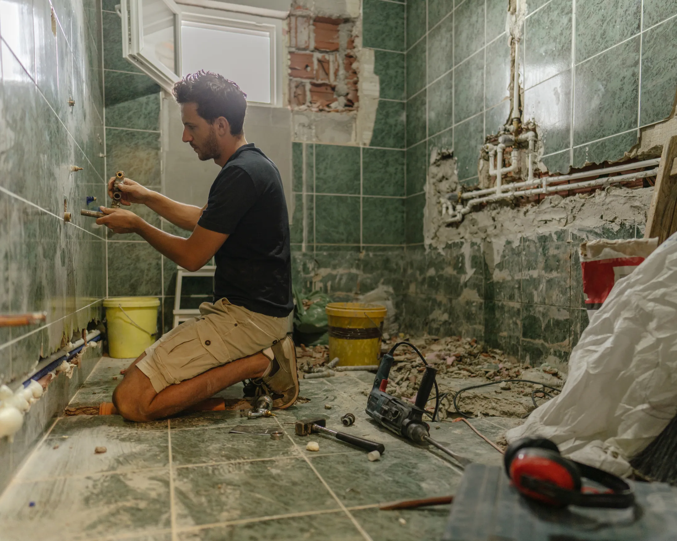 handyman renovating modern bathroom in Toronto condo