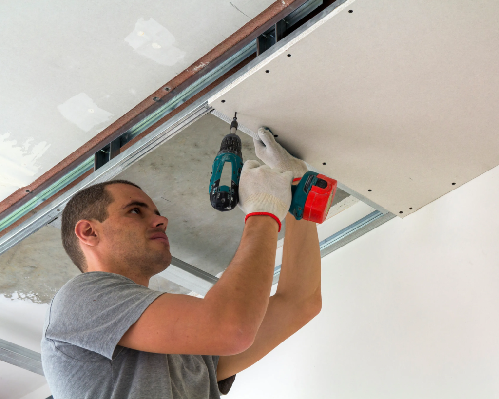 handyman repairing drywall cracks in Toronto home