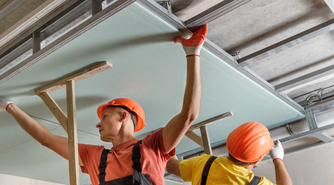contractor installing false ceiling panels in Toronto apartment