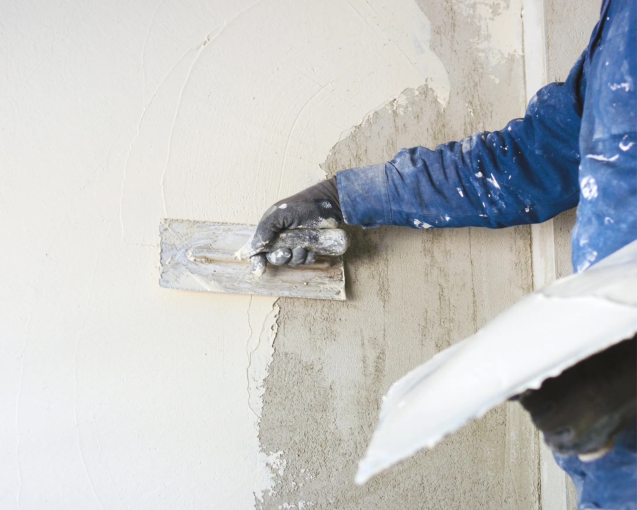 plastering wall surface in Toronto renovation project