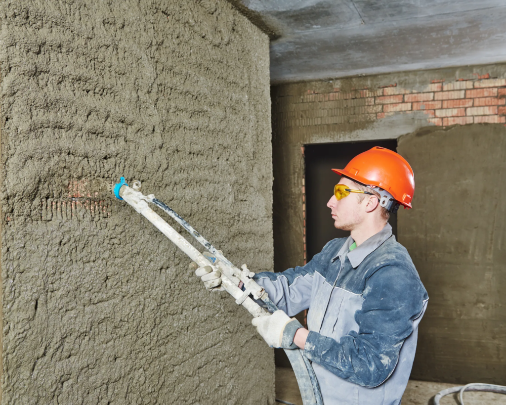 mason repairing concrete wall surface in Toronto house