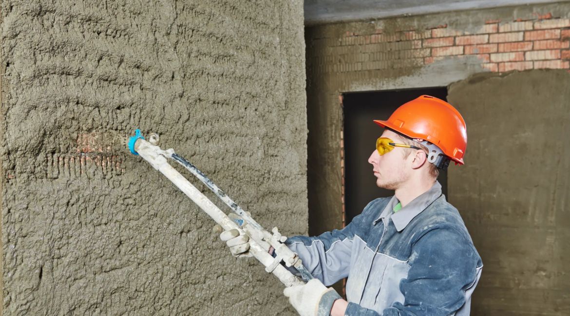mason repairing concrete wall surface in Toronto house