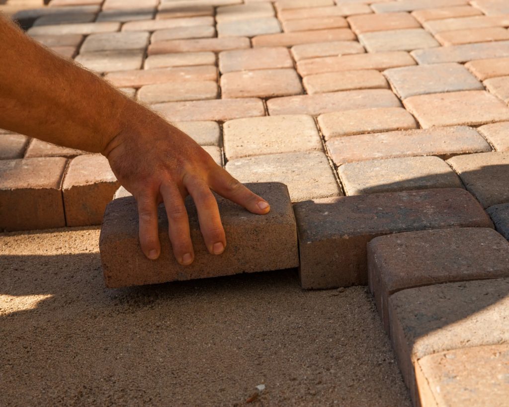 landscaper building outdoor patio space in Toronto backyard