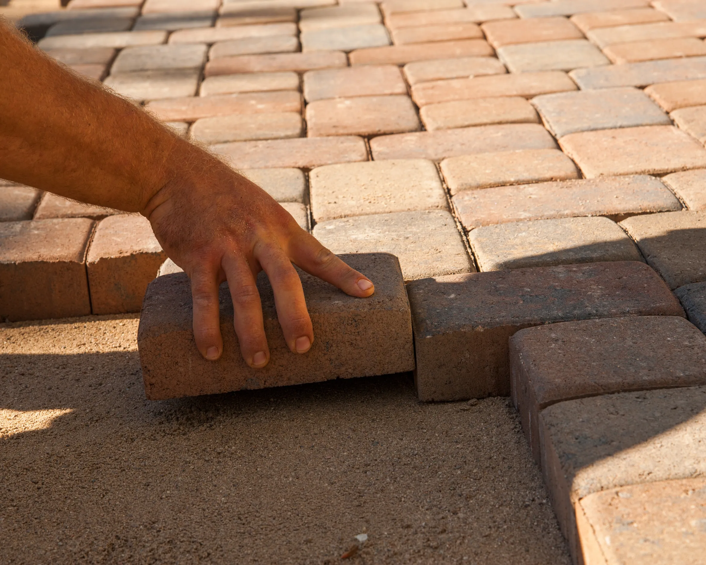 landscaper building outdoor patio space in Toronto backyard
