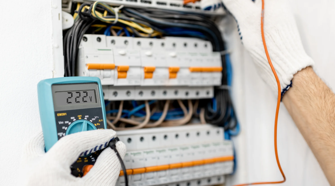 Electrician upgrading a home electrical breaker panel.