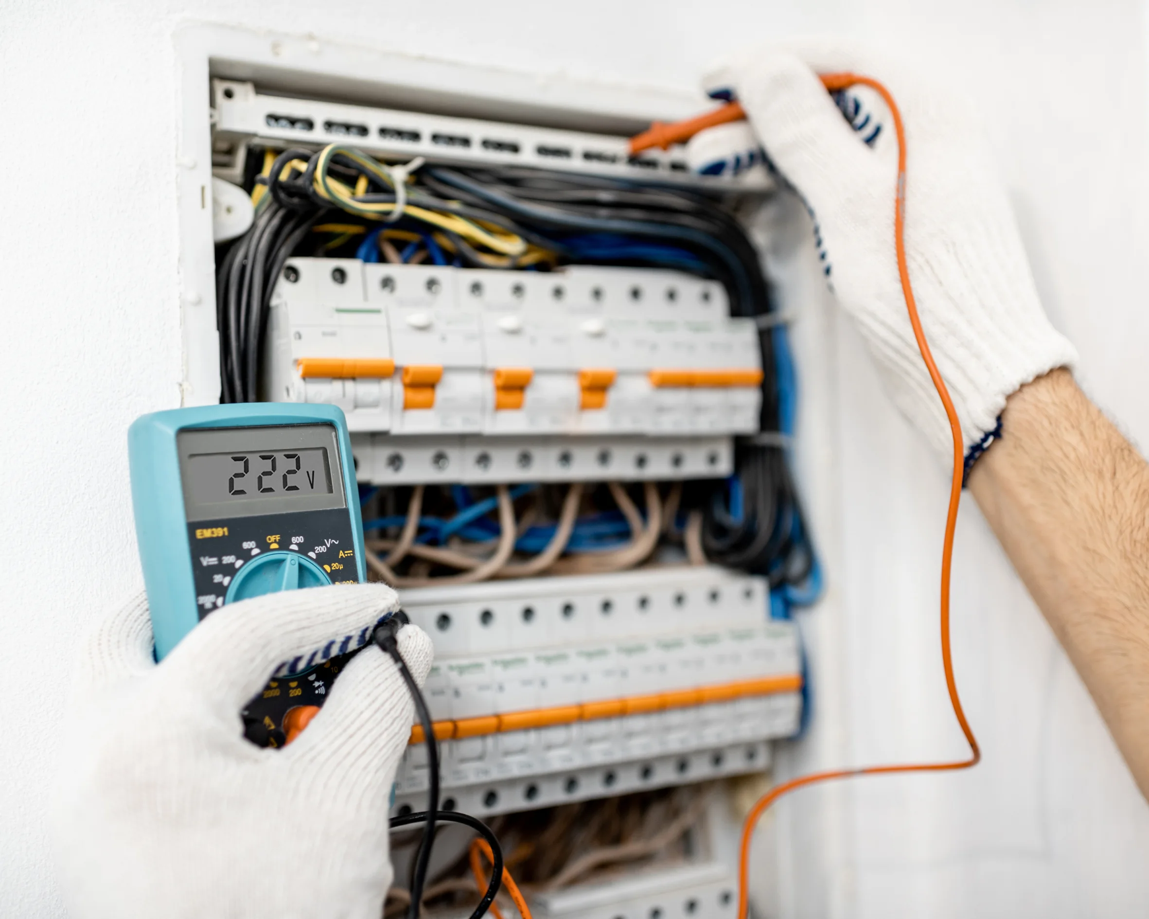 Electrician upgrading a home electrical breaker panel.