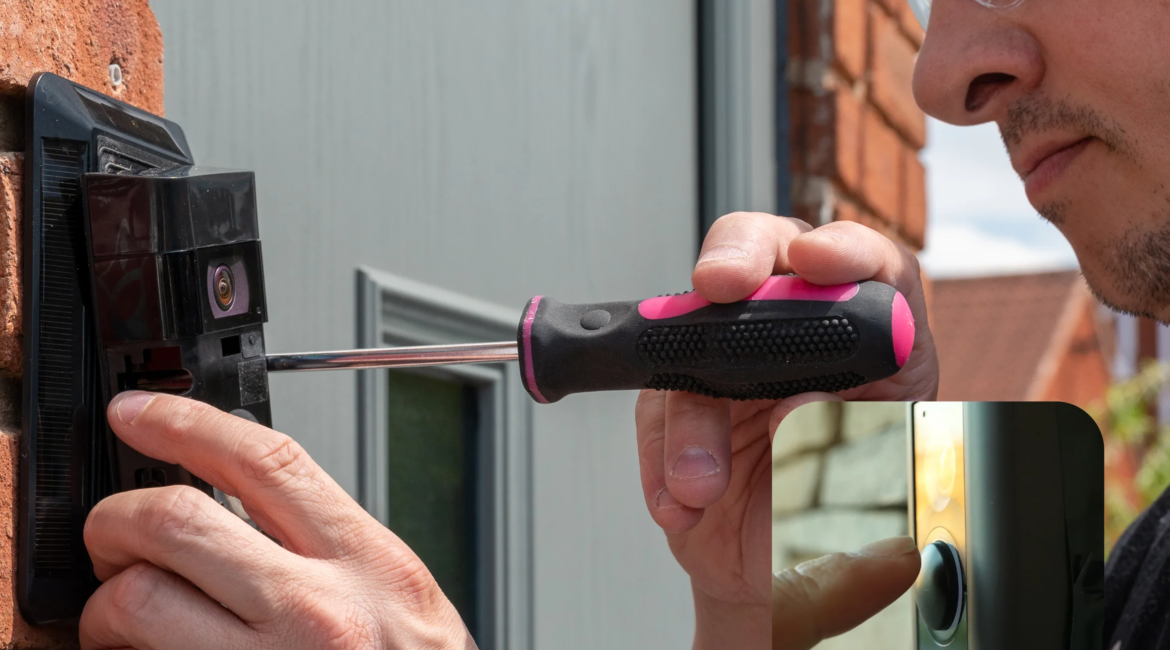 Technician installing a smart video doorbell next to a front door.