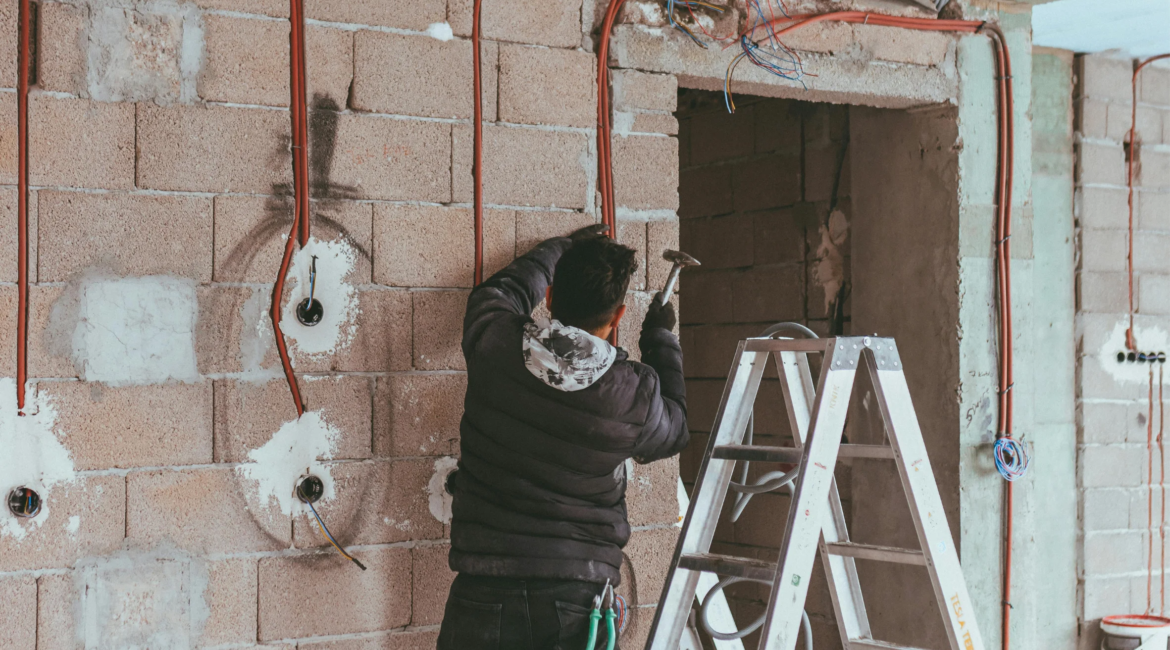 Electrician performing full home electrical wiring installation.