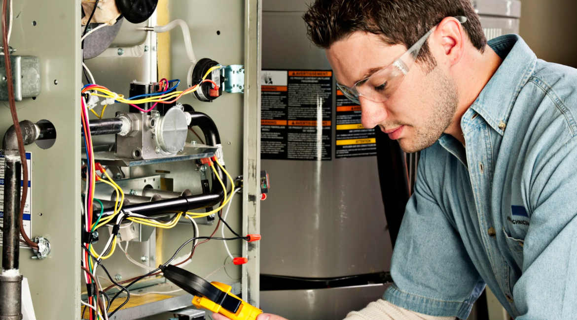 HVAC technician performing furnace inspection and cleaning.